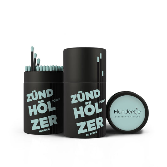 Streichhölzer mit türkisen Köpfen und schwarzem Holz in schwarzer Pappdose von Flundertje